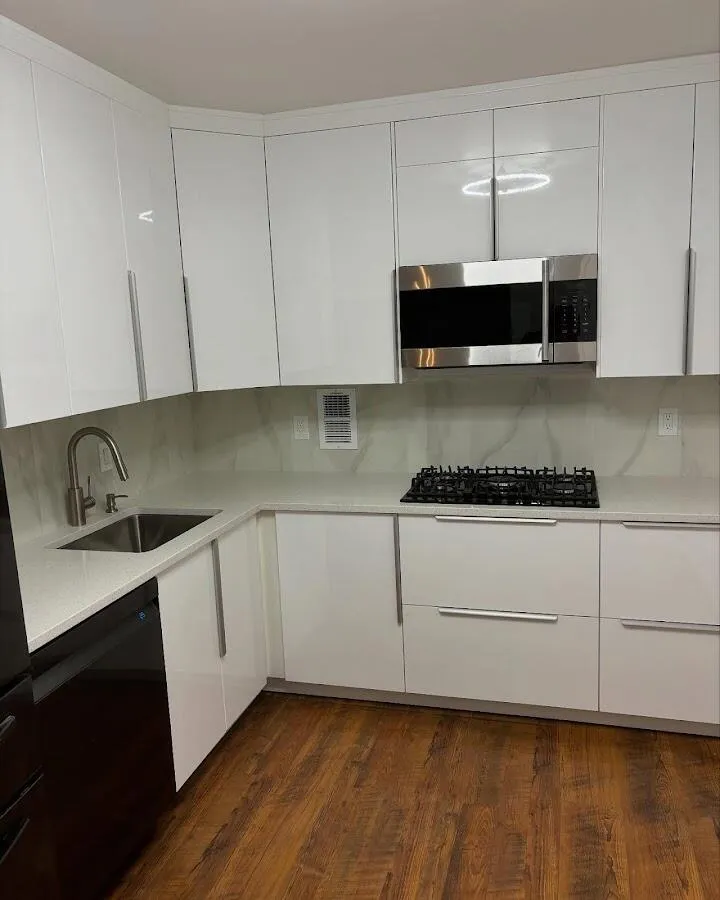 Restored kitchen with white cabinets after water damage in Maywood